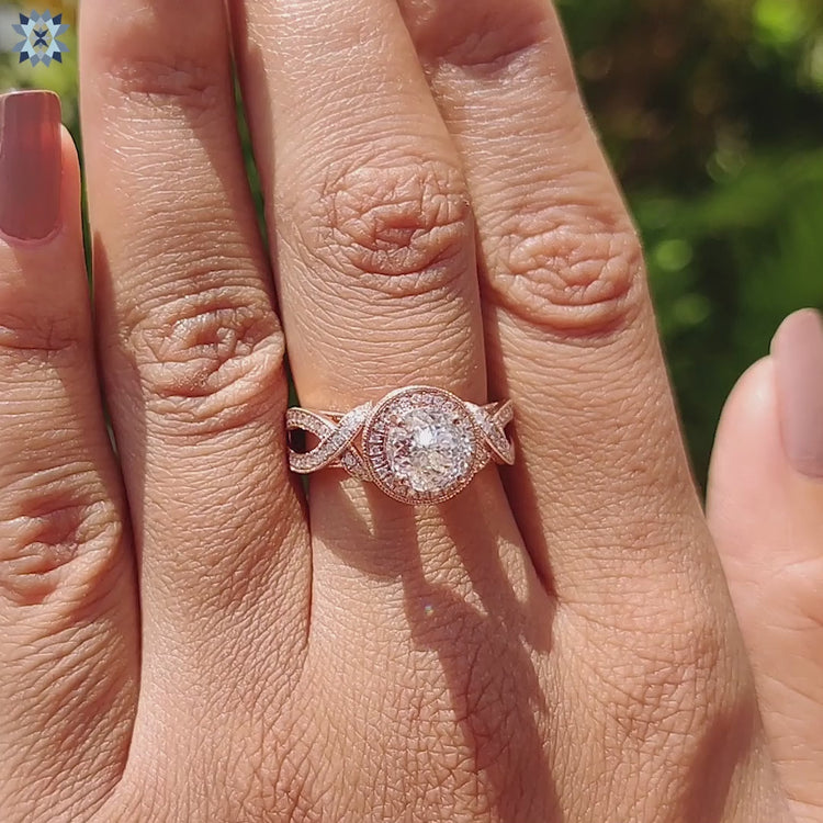 Halo engagement ring with milgrain detail in rose gold.
