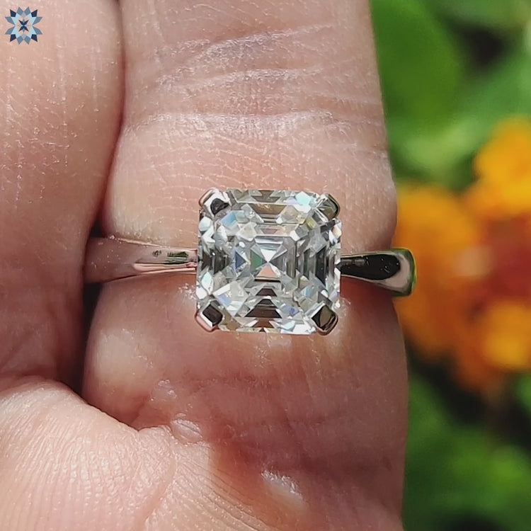 Elegant white gold engagement ring with trellis setting.
