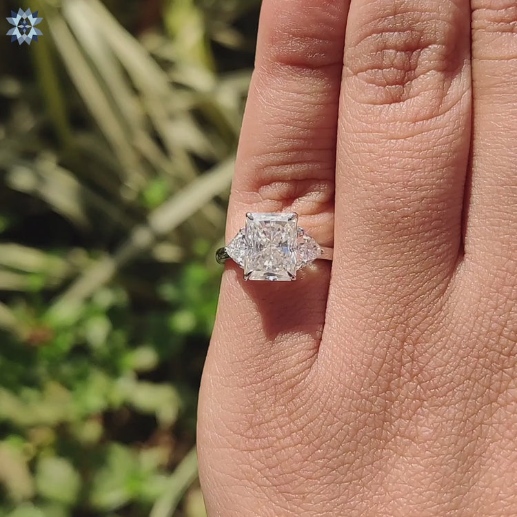 Handmade white gold ring with radiant and trillion moissanites.
