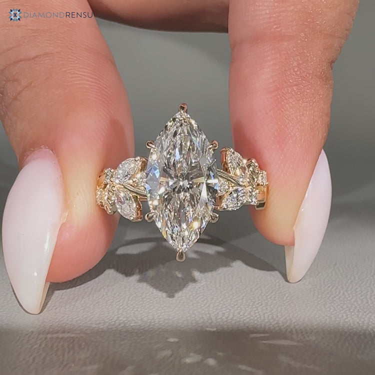 Nature inspired marquise ring with cluster setting.