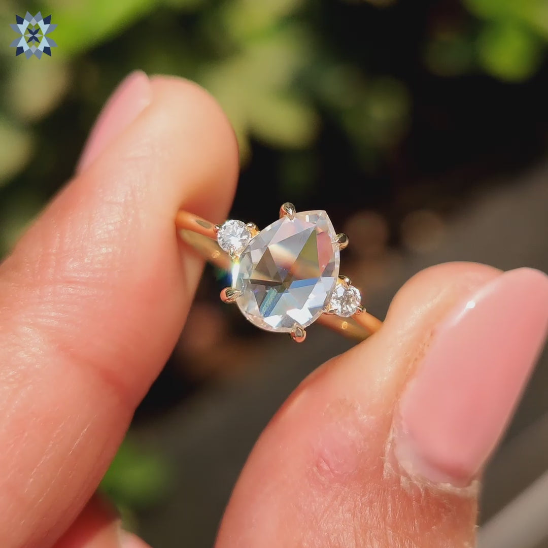 Pear shape ring in solitaire engagement ring design
