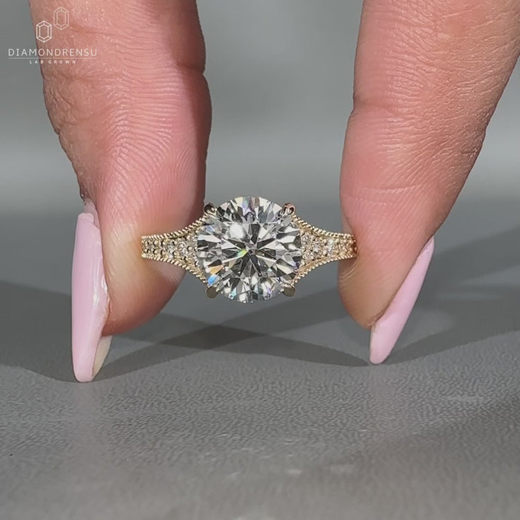 Round diamond engagement ring in a polished style.
