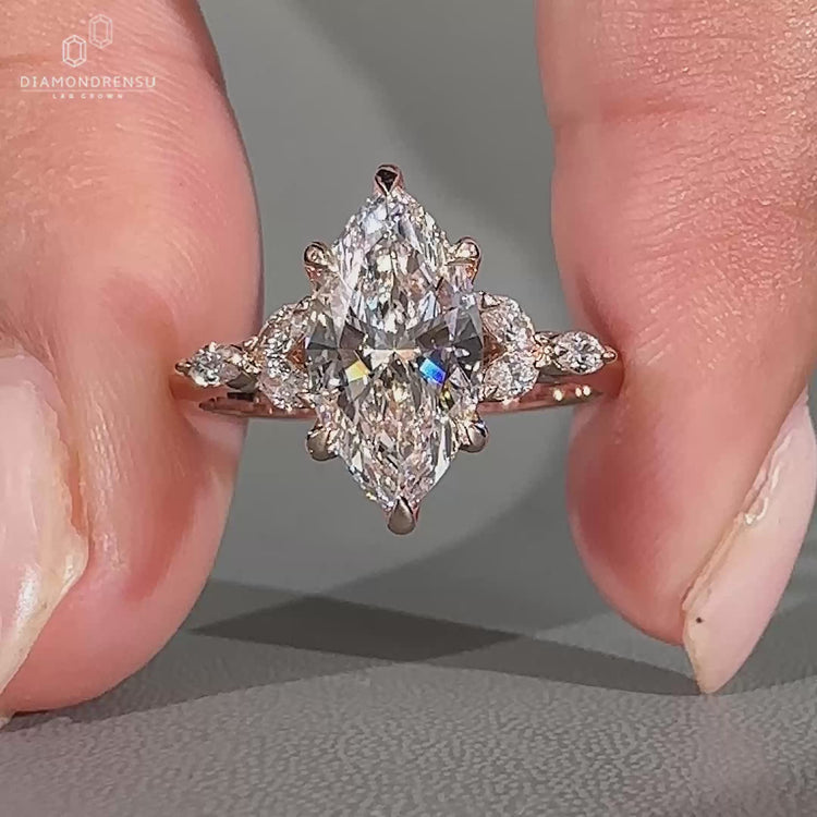 Handmade marquise ring with tulip setting and knife edge band.
