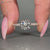 Handmade round cut engagement ring with tulip setting.