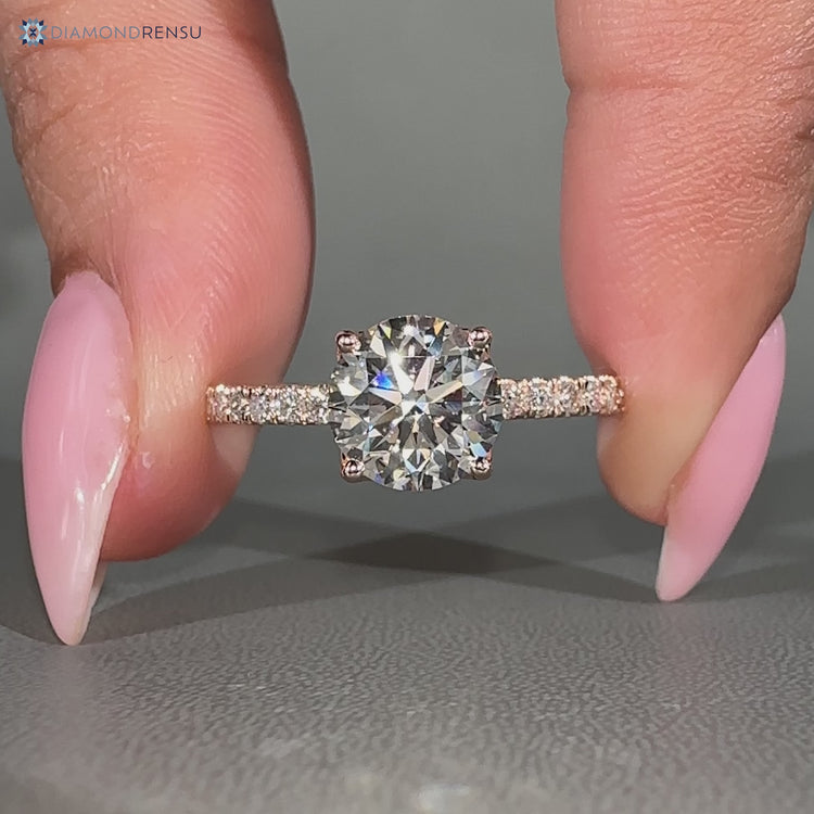 Handmade round cut engagement ring with tulip setting.