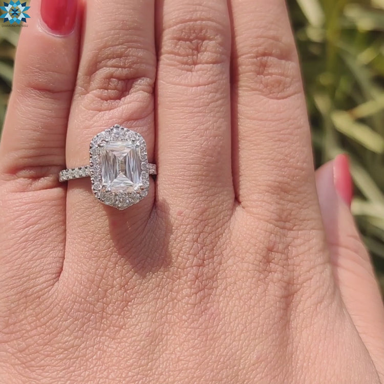 Moissanite halo ring featuring criss cut blue gemstone.
