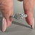 Twisted pave ring design in elegant white gold.
