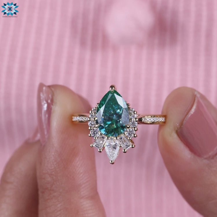 Prong setting engagement ring with green moissanite.
