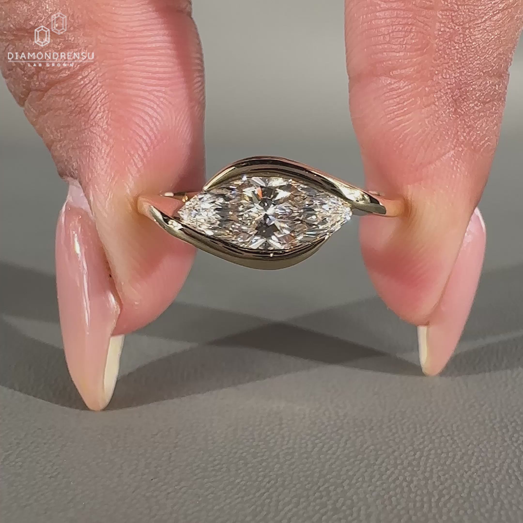 Marquise diamond ring crafted in a unique east west solitaire setting.
