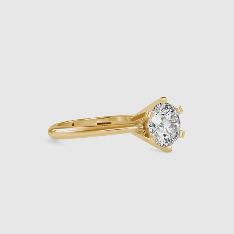 Lab diamond ring with six prong solitaire and clean gold finish.