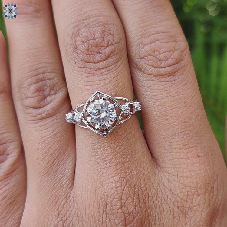 Octagon shaped moissanite ring with heart prong design.
