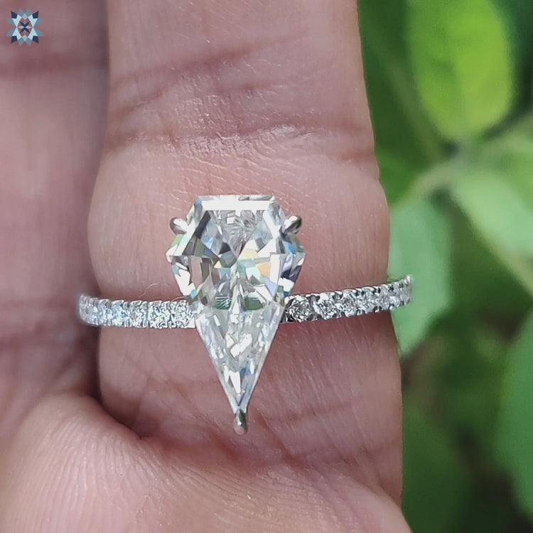 Handmade jewellery featuring spear moissanite center stone.
