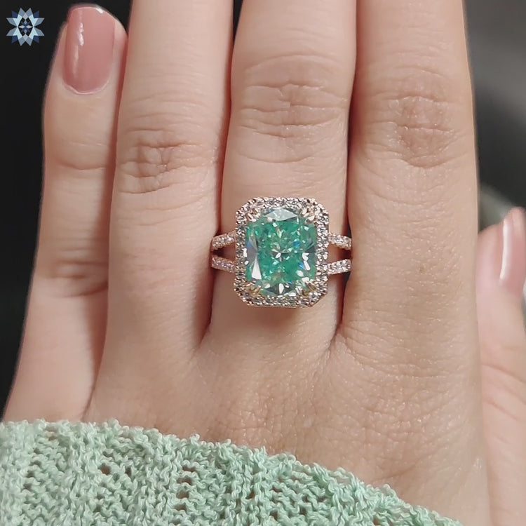 Moissanite halo ring with split band design.
