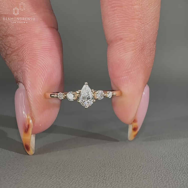 Yellow gold 5 stone engagement ring with teardrop diamond