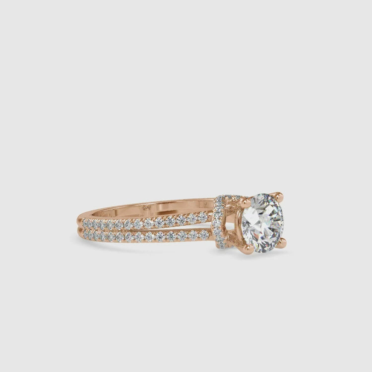 UK engagement ring in yellow gold with round diamond halo.
