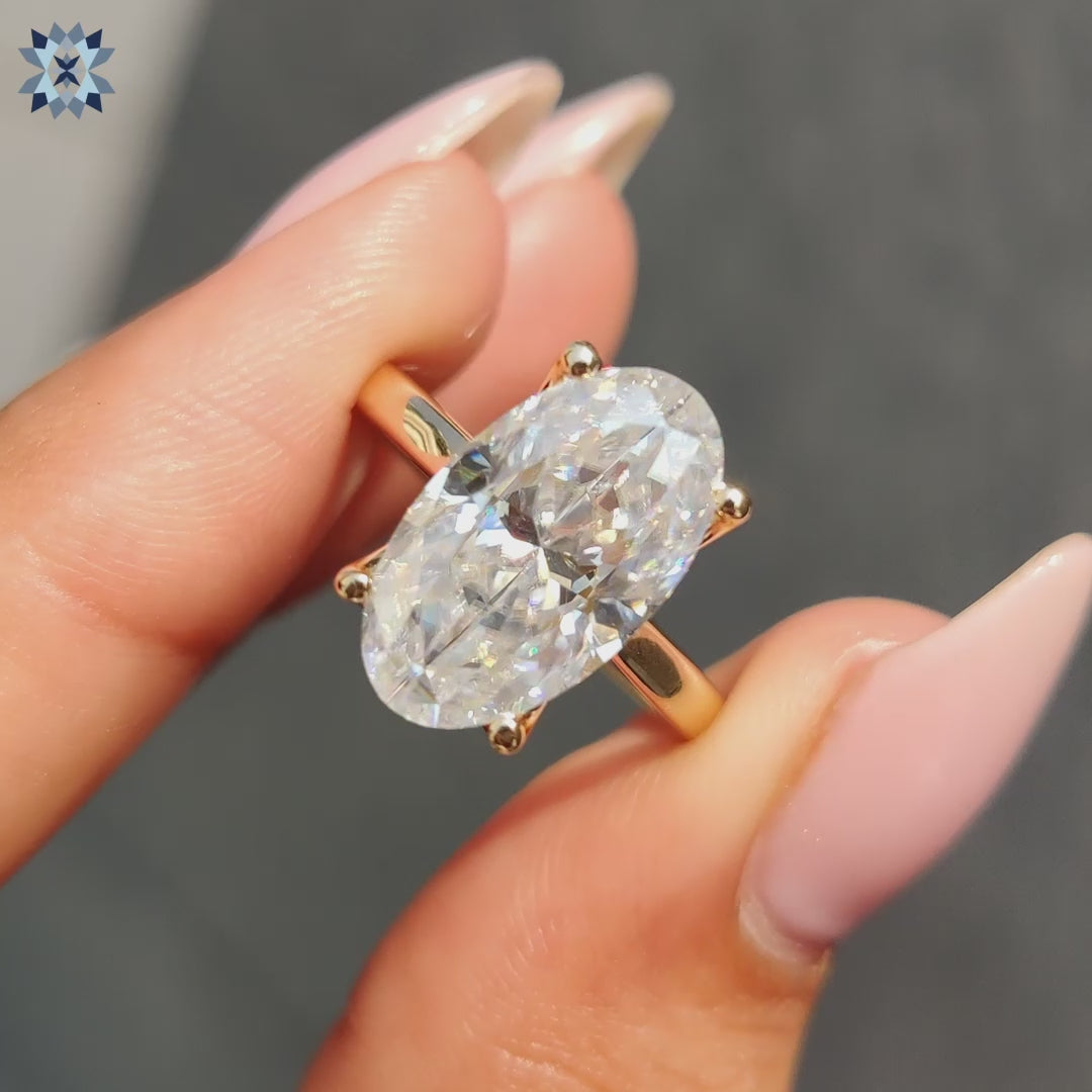 Moval Cut ring in 4 prong ring setting
