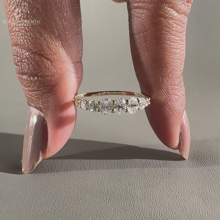 Yellow gold half eternity diamond wedding band.
