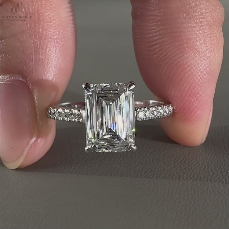Pave setting emerald engagement ring designed with lab grown diamond and handmade jewelry details for timeless charm.