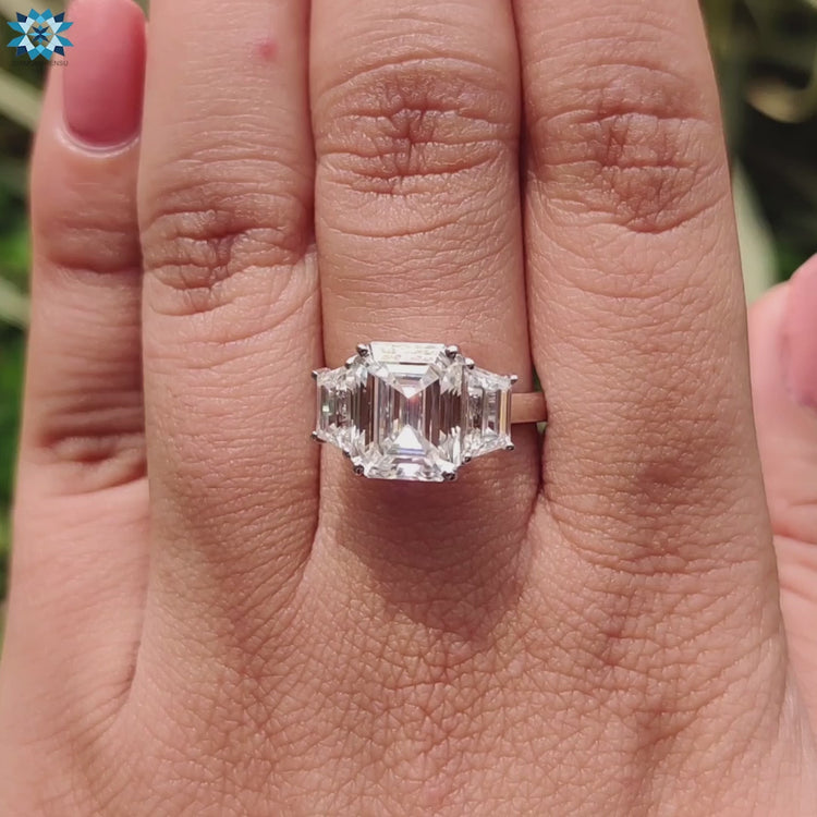 Handmade jewellery featuring three moissanite stones in a cathedral mount.
