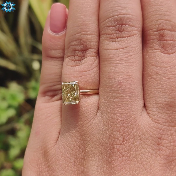 Handmade radiant solitaire ring in yellow gold.

