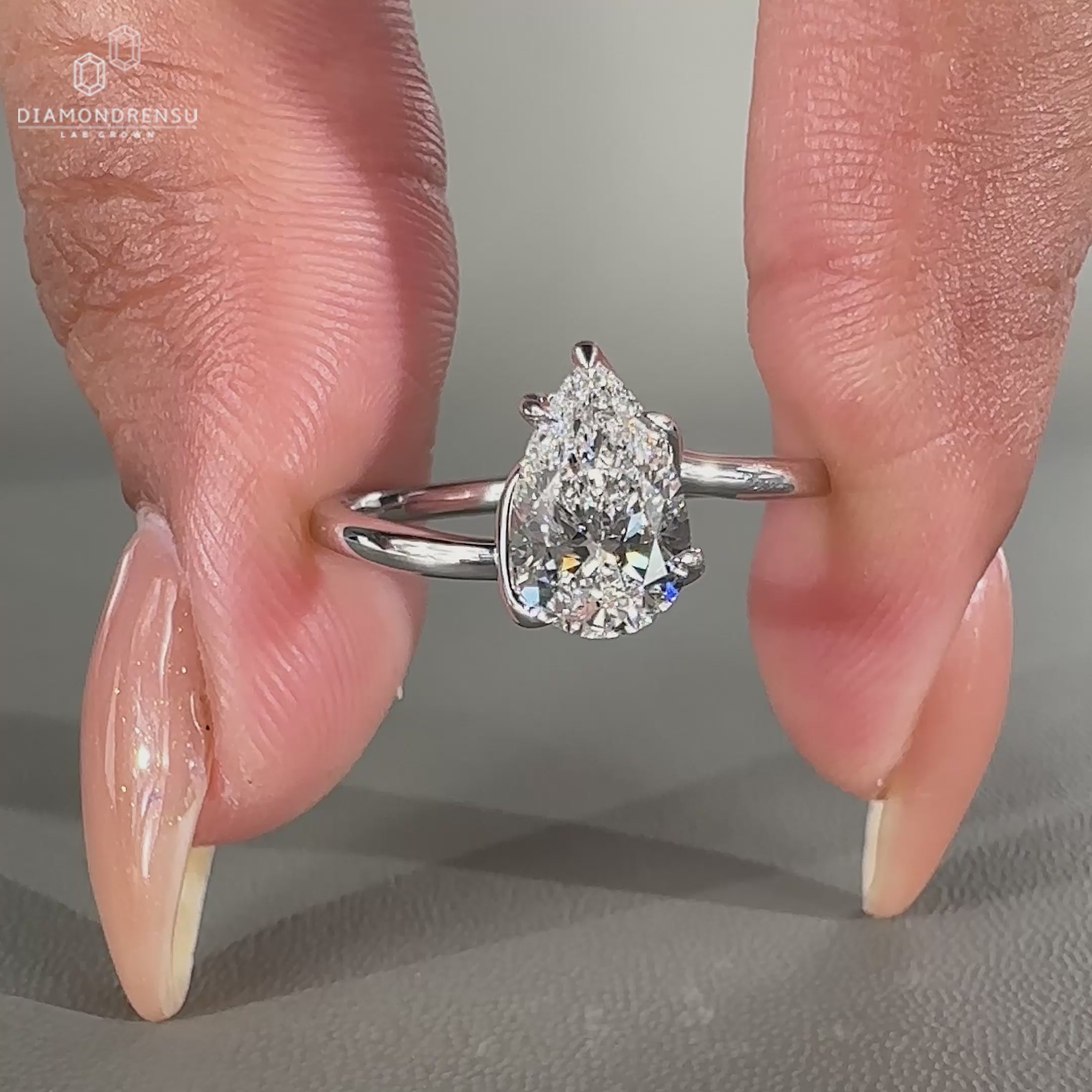 Pear shaped diamond ring set in white gold.
