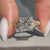 Princess cut diamond ring with tapered shank.