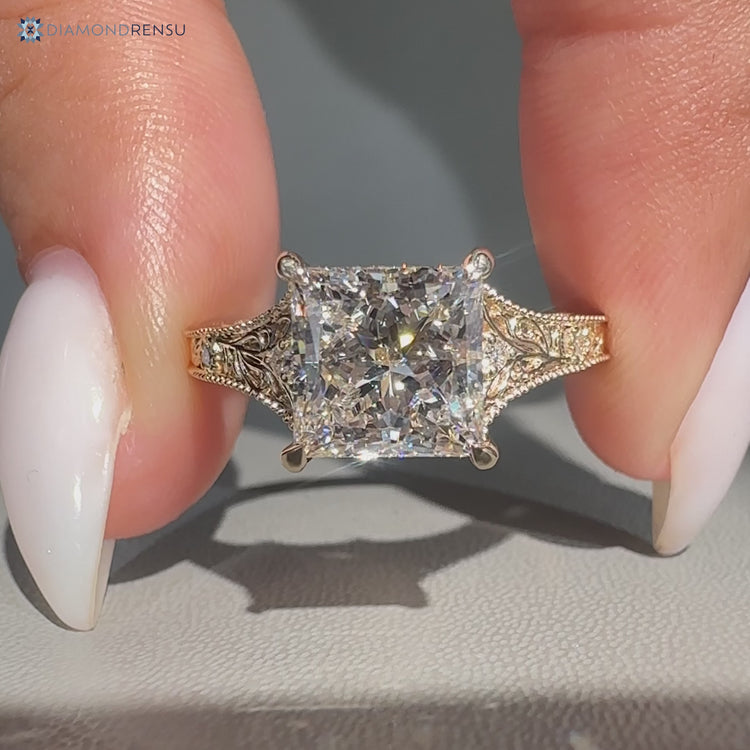 Princess cut diamond ring with tapered shank.