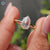 Handmade yellow gold engagement ring with pear rose cut Moissanite solitaire.
