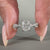 White gold engagement ring with twisted pave band