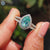 White gold engagement ring with split shank pave band design.
