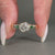 Bezel setting added to three stone diamond ring design.