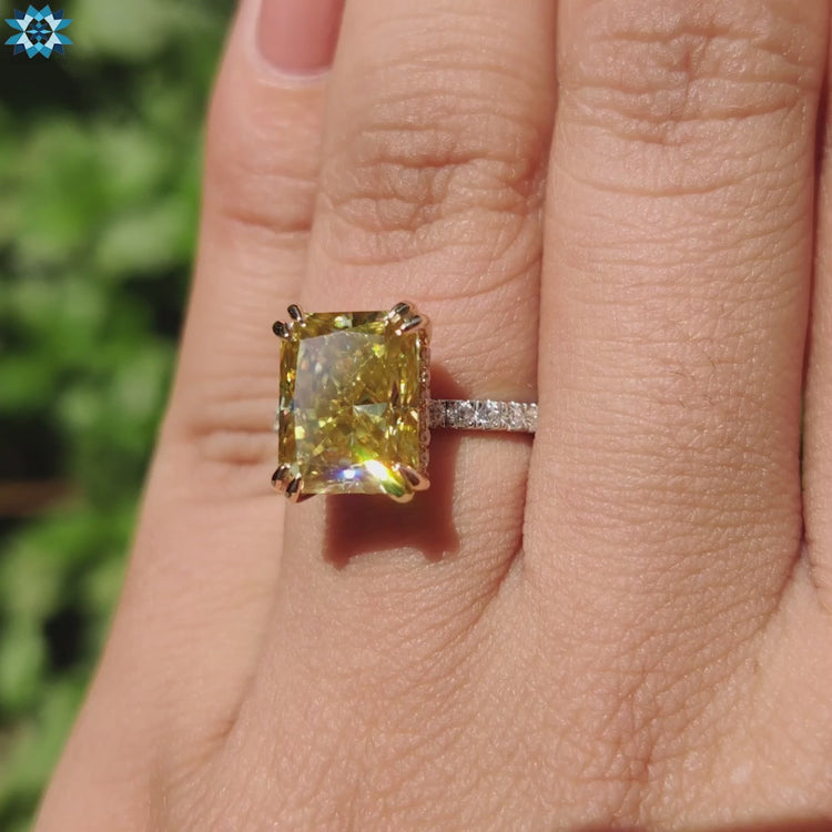 Moissanite engagement ring in mixed metal gold.
