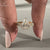 Hidden halo pear diamond bridal set.

