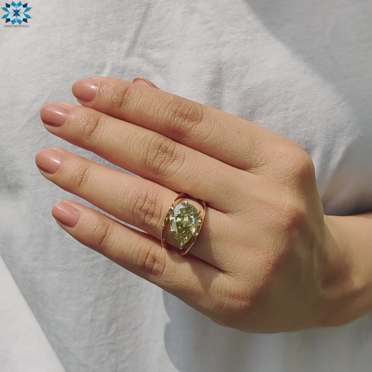 Yellow gold custom pear shaped ring.

