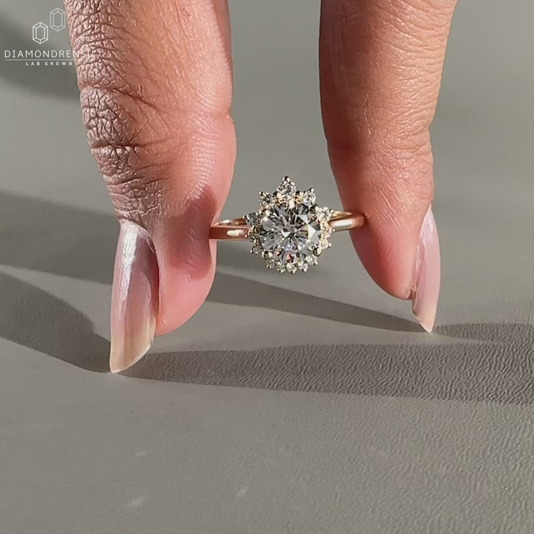 Round diamond ring designed with round side stones.
