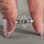 Lozenge cut ring paired with kite side stones.
