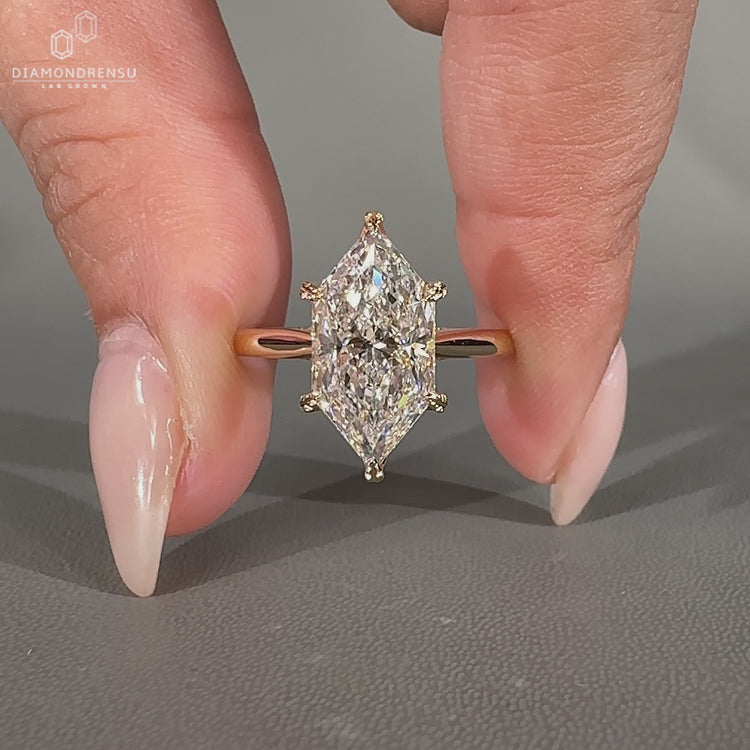Lab grown marquise diamond ring with tulip prong setting.