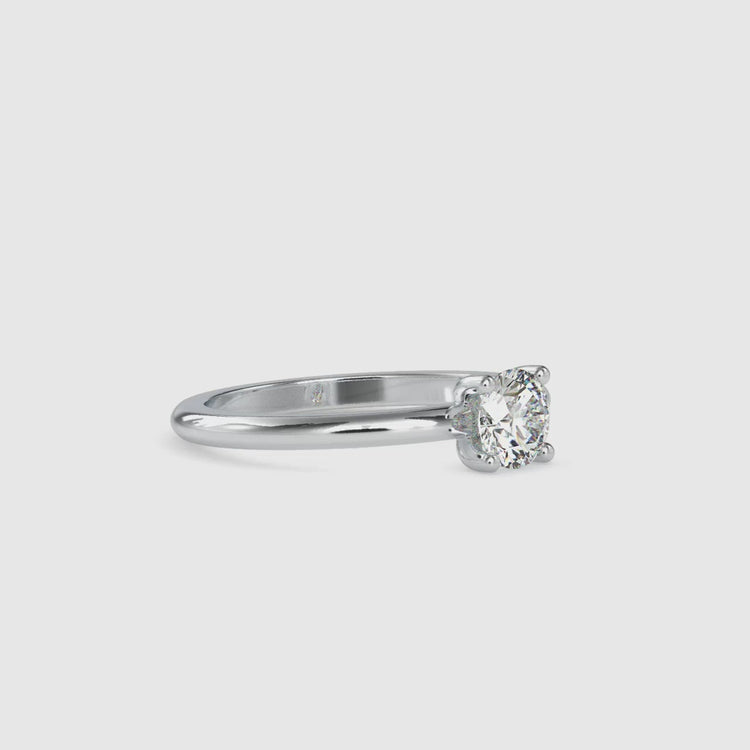 Yellow gold diamond ring with round cut solitaire and custom design.
