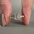 3 diamond engagement ring with tapered baguette side diamonds and 4 claw prong set ring.
