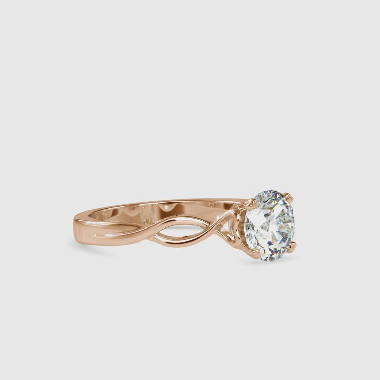 Lab grown diamond twisted engagement ring in yellow gold.
