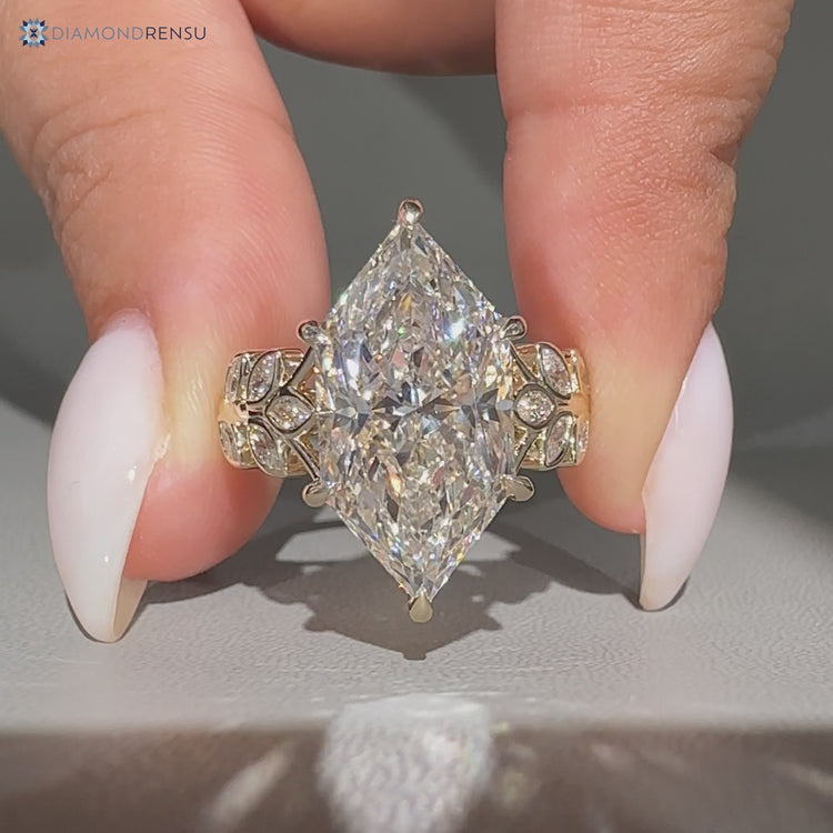 Handmade Dutch marquise ring with cluster setting.