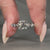 Round cut diamond engagement ring with side stones