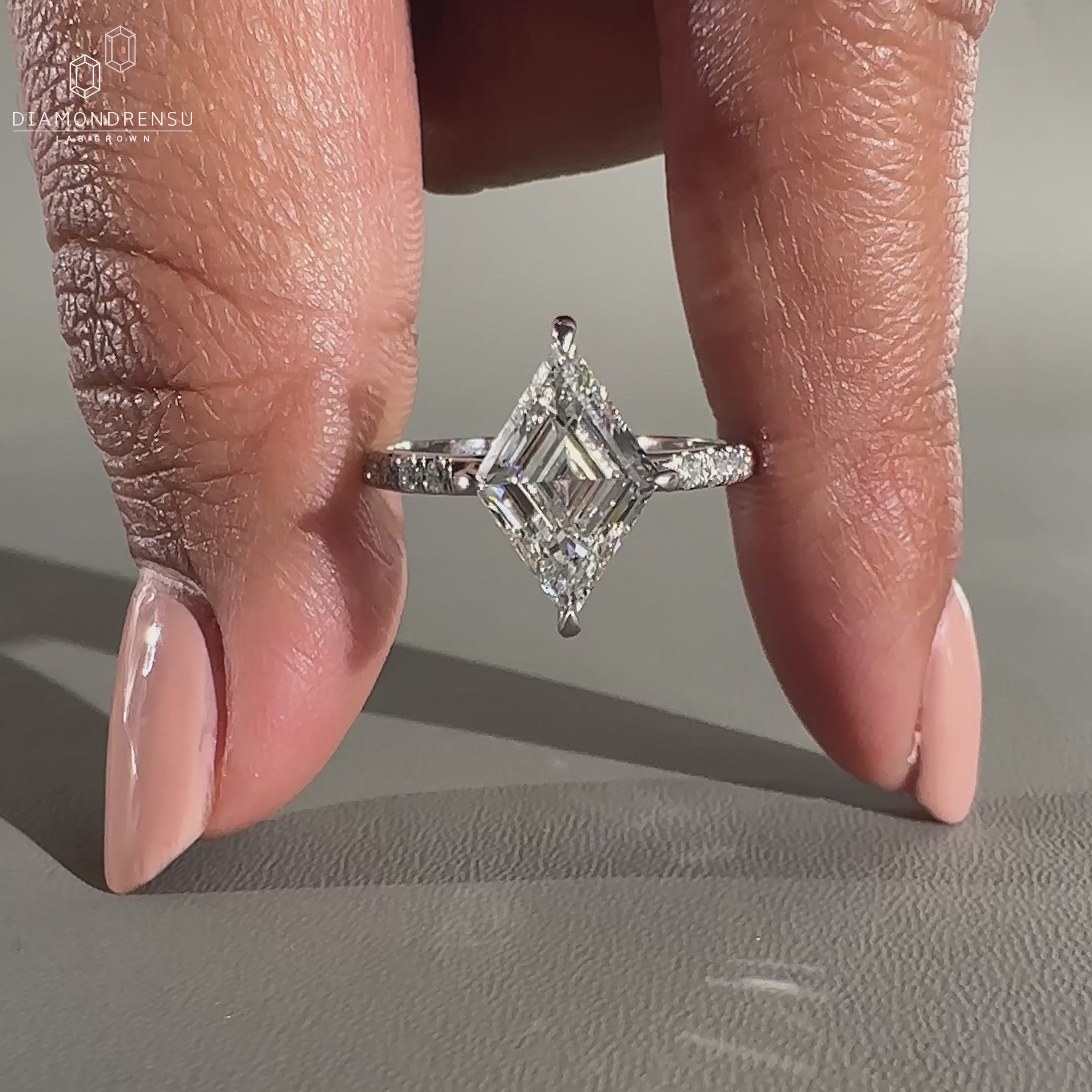 Handmade engagement ring featuring a round cut in a pavé setting.
