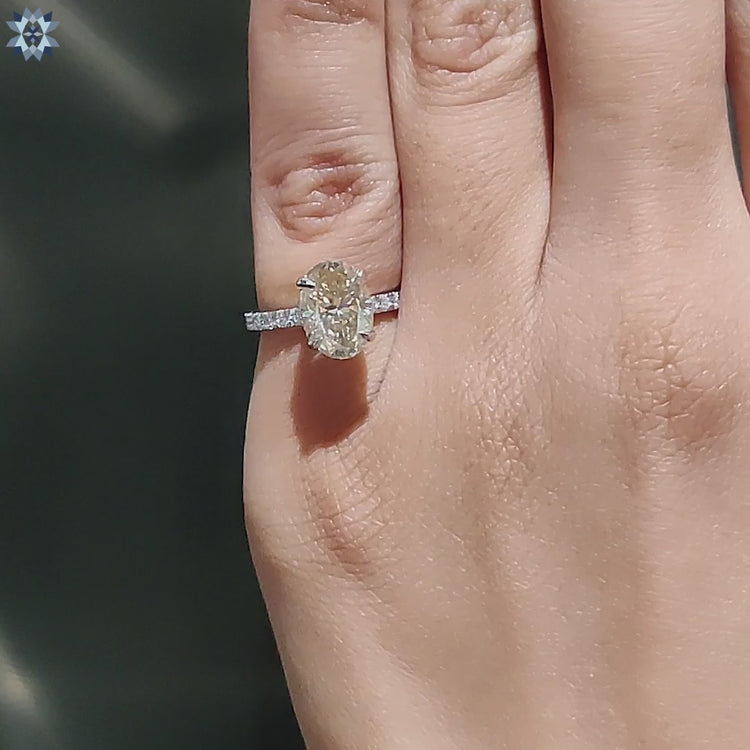 Handmade jewellery with oval cut moissanite and halo.
