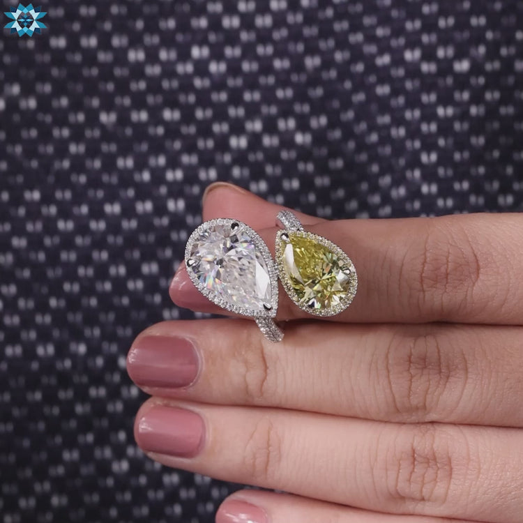 Toi et moi ring with contrasting pear shapes in a handmade white gold band.
