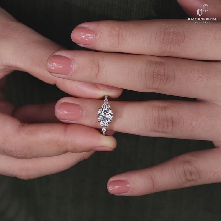 4 prong diamond ring with handmade jewelry craftsmanship and marquise side stones for a modern touch.