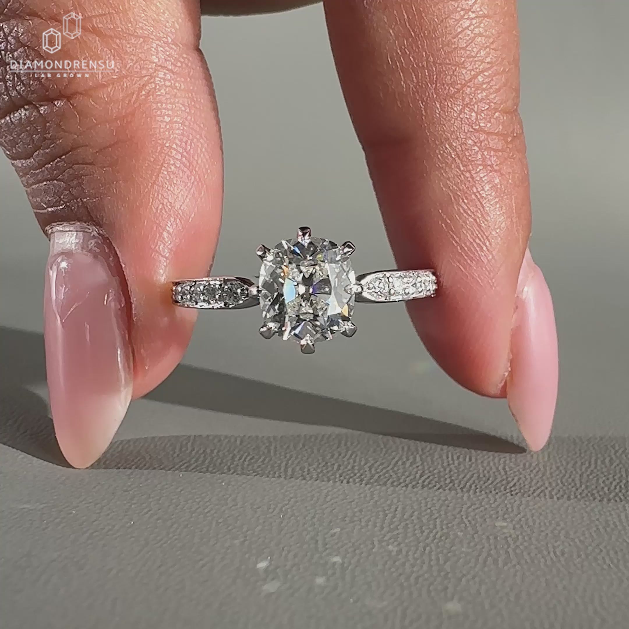 Cushion old mine cut ring in claw prong ring setting for UK engagement ring.
