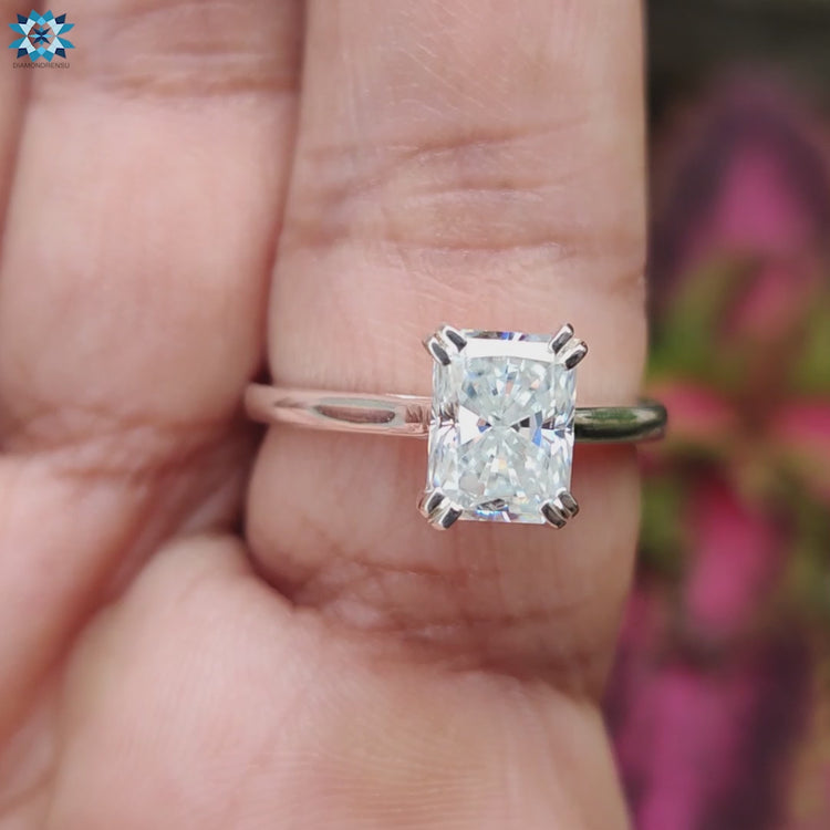 Classic radiant engagement ring with raised cathedral band.
