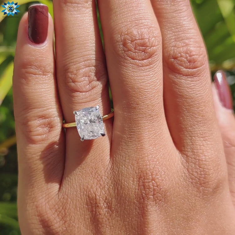 Four prong solitaire ring in two-tone gold.

