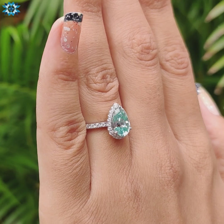 Elegant handmade jewellery piece with halo setting and pave band.
